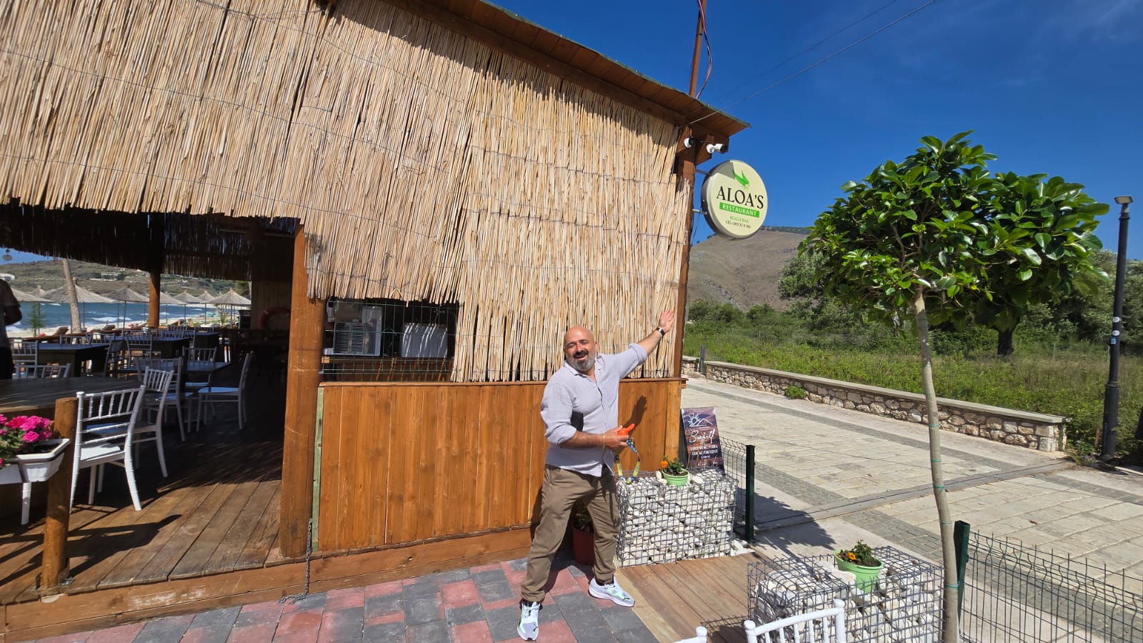 Welcome to Aloa's — the host at the entrance